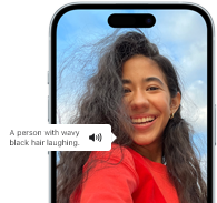 iPhone 15 showing Voiceover feature announcing the picture information, A person with wavy black hair laughing