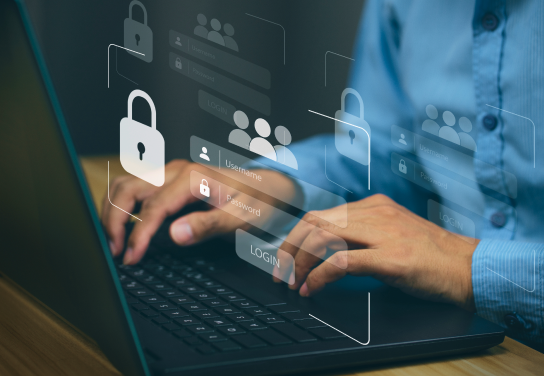 Image of person typing on a laptop with an overlay of an image of a user name and password and a padlock