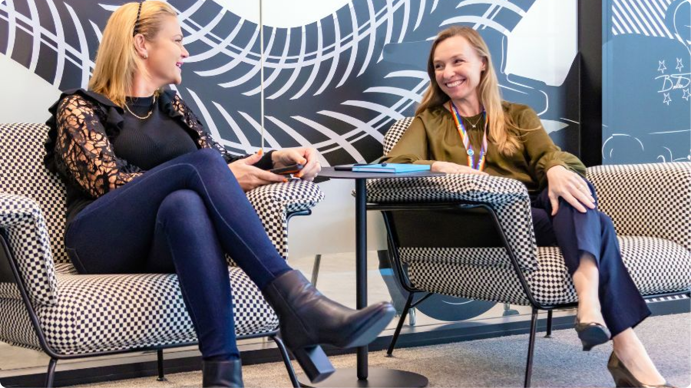 Photo of two women in the 2degrees office having a conversation