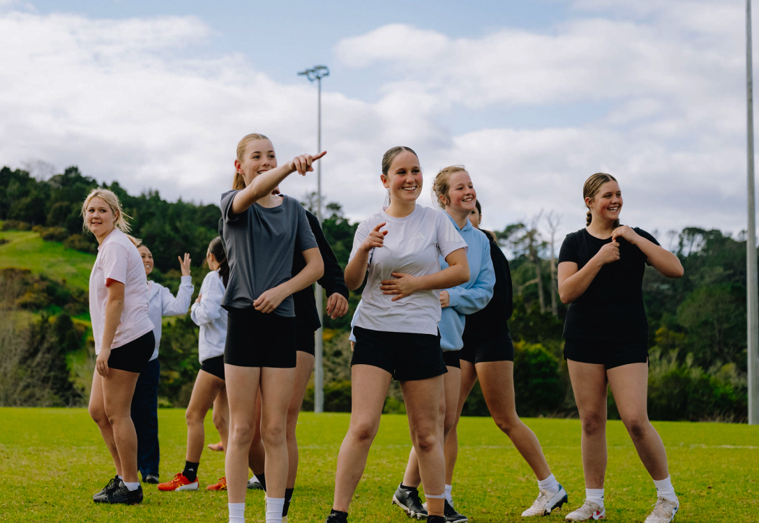 Photo of girls training out on a field
