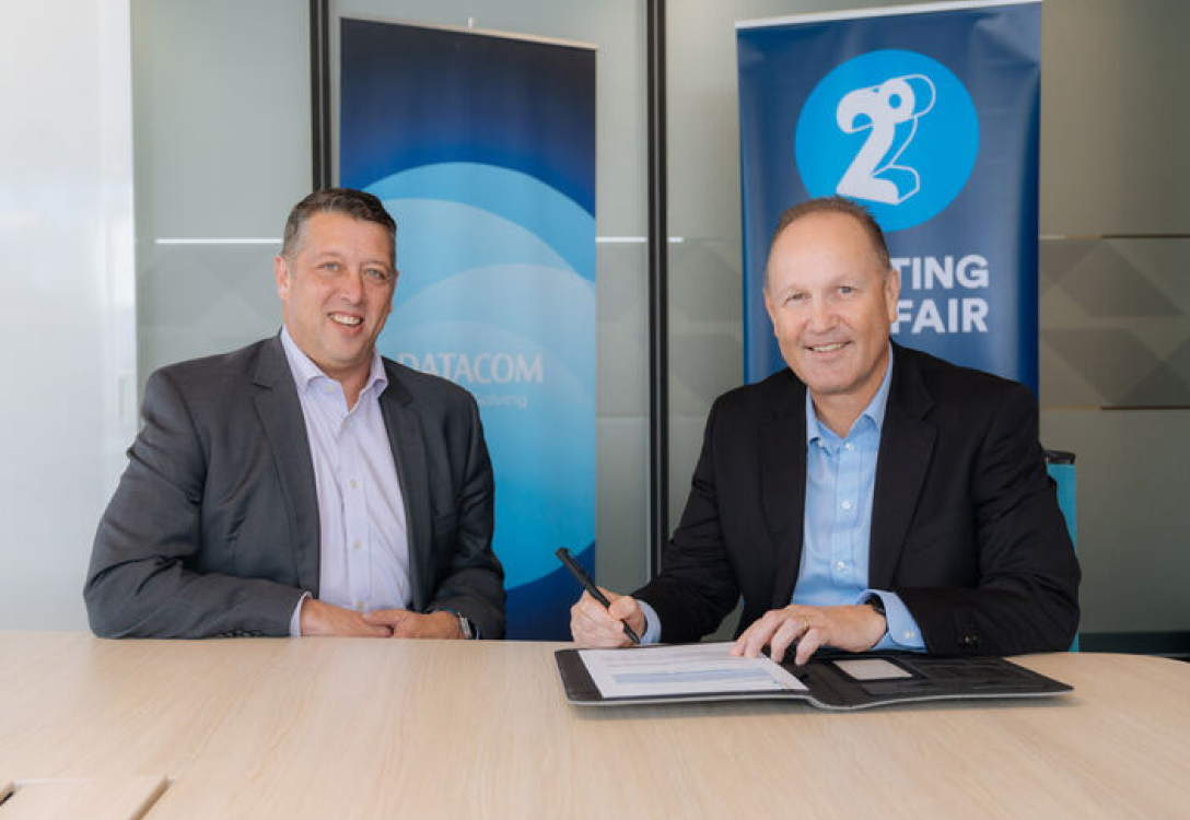 Photo of Andrew Fairgray and a Datacom representative