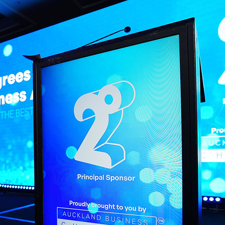 Photo of a lectern showing the 2degrees logo as a proud sponsor