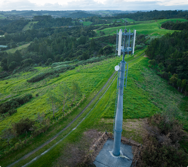 Photo of a network tower in a field