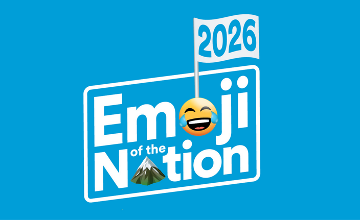 Emoji of the Nation 2026 with a crying laughing emoji face as the "O" in "emoji" and a mountain emoji as a "A" in "nation" a flag coming out of the emoji face with 2026 written on it